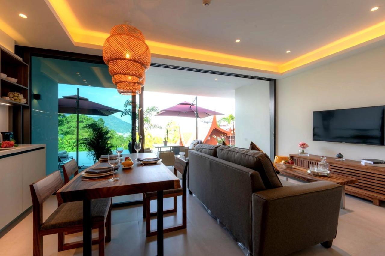 Patong Heights Hotel Buitenkant foto A living room in a villa